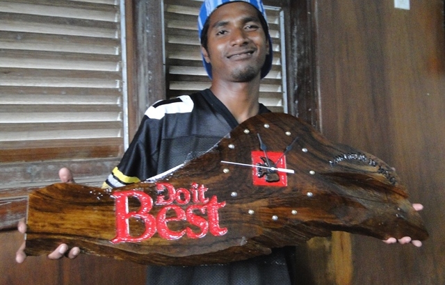 Former WAM trainee Rinky Hersey with a clock he produced for Majuro hardware store Do It Best.