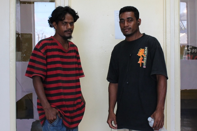 Alumni Coon Anitak, left, was a WAM trainee in 2013 and is now a trainer in MIDB Self-Help building program. At right is Peter Janer, who was in the same training program as Coon and also was hired on by the MIDB Self-Help building program.