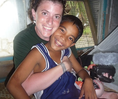 Rachel Miller hugs her host brother, Paul Beasha, on Namdrik in 2010.