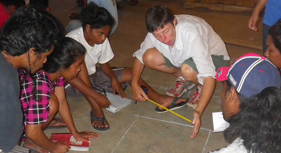 Instructor Jane Evans works with the 2012-13 trainees on honing their math skills.