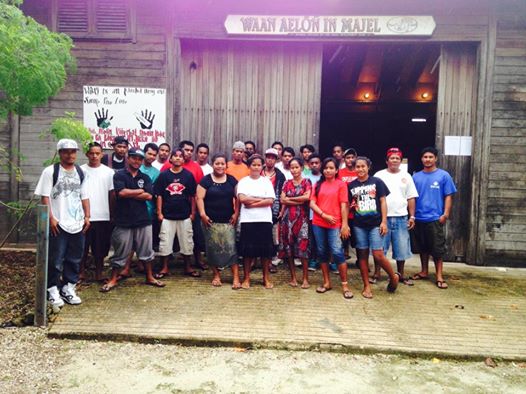 WAM's current trainees (September, 2014) pose for the camera outside the main building in Delap.