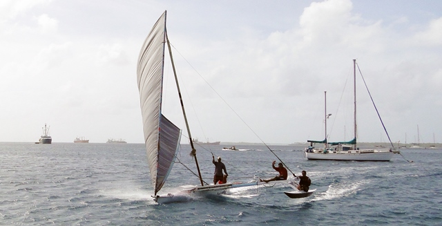 A trio of guys zip along Majuro lagoon.