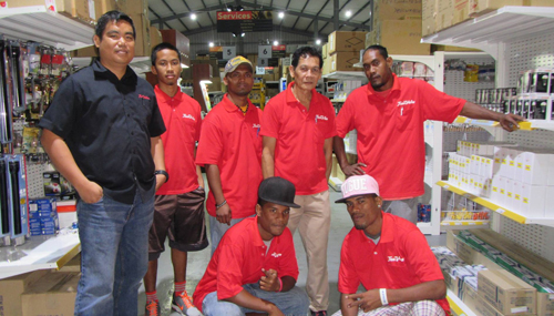 WAM 2015 alumni Michealson Jihu and Jammy Edward, at front, with there colleagues at the True Value Store in Delap. Photo: Tolina Tomeing