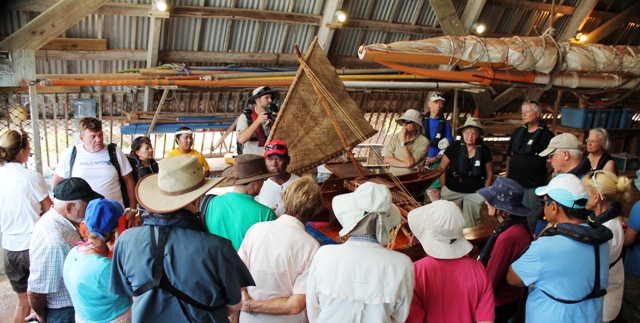 WAM's Binton Daniel gives visitors a talk on the traditional canoes. Photo: Joel Bowman