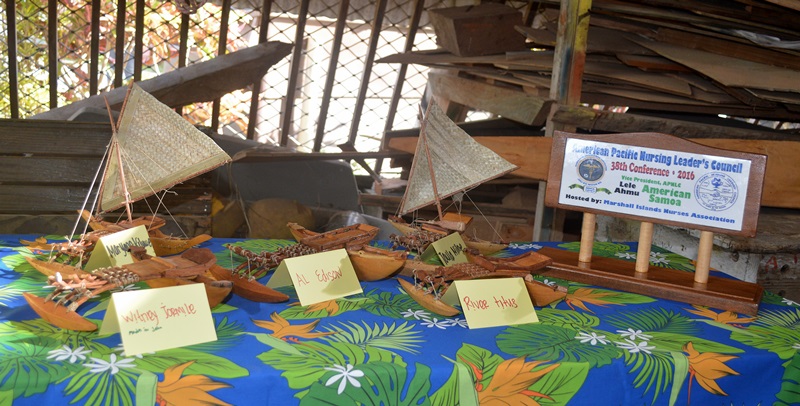 Some of the miniature canoes and a plaque made by the WAM trainees. Photo: Karen Earnshaw