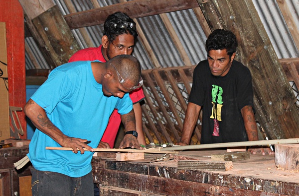 Picture frame construction by GEF Trainees Maston John and Rusty Riklon w/trainer Gregory Jokray. Photo: Sealend Laiden