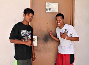 WAM trainees Dalas Henry and Jerry Anjain applying for identification cards. Photo: Sealend Laiden