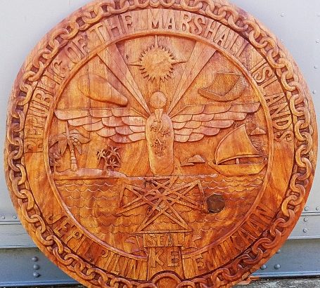 GEF Trainees create a beautiful carved Government Seal from Lukwej. Photo: Suemina Bohanny