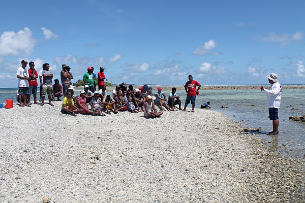 Director Alson Kelen with trainees giving instruction on climate change and the importance of protecting the environment. Photo: Suemina Bohanny