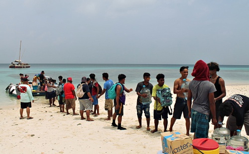 Unloading supplies at Eneko. Photo: Rosan Bartolome