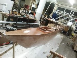 Epoxy being applied to the canoe. Photo: Esther Kokmeijer